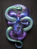 skull with snake wall art